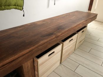 mudroom organization-bench with storage boxes underneath