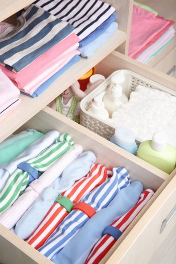 If you're a fan of Marie Kondo, you know she suggests standing things upright, so you can see what you have. For more tips on storing baby clothes, look here. 